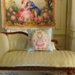 Miniature pillow with fairy piglet surrounded by roses and lavender