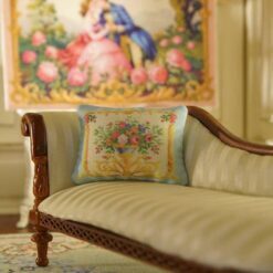 Miniature pillow design with a floral bouquet in a gold ornate frame