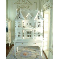 Victorian-style miniature dollhouse cabinet in white on a two-drawer table