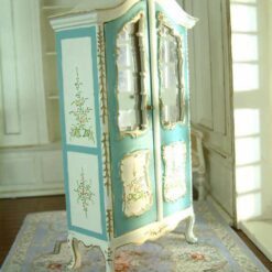 White dollhouse kitchen cabinet with marble-style countertop