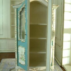 White dollhouse kitchen cabinet with marble-style countertop