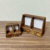 Miniature two-drawer cabinet kit with patterned back panels.