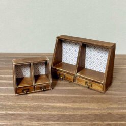 Miniature two-drawer cabinet kit with patterned back panels.