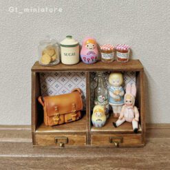 Miniature two-drawer cabinet kit with patterned back panels.