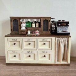 Double-door dollhouse cabinet with metal label accents