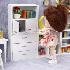 Set of four miniature wooden cabinets in various finishes for dollhouse storage