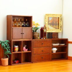 Set of four miniature wooden cabinets in various finishes for dollhouse storage