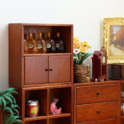 Set of four miniature wooden cabinets in various finishes for dollhouse storage
