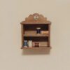 Dollhouse Miniature Spool Storage Cabinet Kit 1 A miniature spool storage cabinet with vintage design.