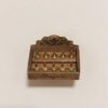 A miniature staircase spool storage box with decorative details.