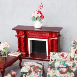 Miniature red baroque fireplace for dollhouse with intricate pillar design