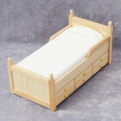 Miniature wooden bed with green bedding for dollhouse