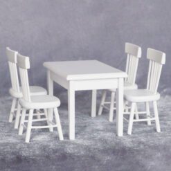 Miniature dining table with 4 chairs, perfect for dollhouse living spaces.