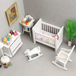 Miniature white nursery furniture set including crib, dresser, rocking chair, and more.