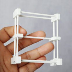 Miniature white towel rack made from wood and bamboo for dollhouse bathrooms.
