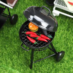 Miniature metal barbecue grill with round top and black finish