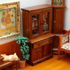Miniature wooden storage cabinet with shelves and drawers for dollhouses.