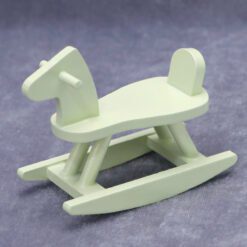 Miniature nursery furniture set including crib, cradle, high chair, and more.