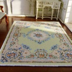 Miniature Victorian rug with yellow background and floral border