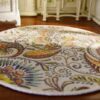 Miniature Persian paisley rug with rich swirls, flowers, and bold colors.