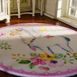 A whimsical miniature rug with an alpaca, flowers, and balloons