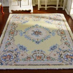 Miniature Victorian rug with yellow background and floral border