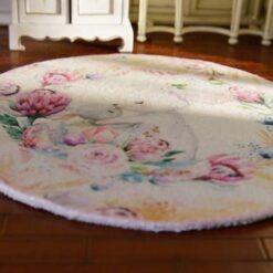 A round rug with a rabbit mother and baby surrounded by delicate flowers