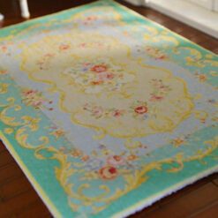 Victorian style miniature rug with turquoise and yellow floral motifs