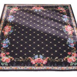 Floral miniature rug with a black background and rose border accents.