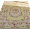Yellow Aubusson style miniature rug with floral pattern and scroll detailing