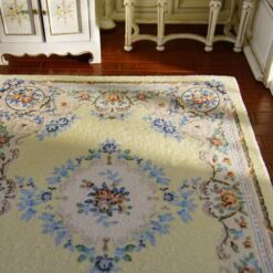 Miniature Victorian rug with yellow background and floral border