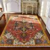 Miniature Persian rug with a red base, floral medallion, and intricate detailing.
