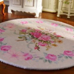 Miniature shabby chic Victorian rug with a soft floral pattern featuring pink roses.