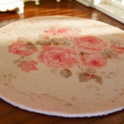 Miniature shabby chic rug with a pink rose bouquet and soft floral details.