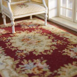 Aubusson style miniature rug in red and beige with floral motifs