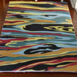 Modern abstract miniature rug with colorful flowing pattern