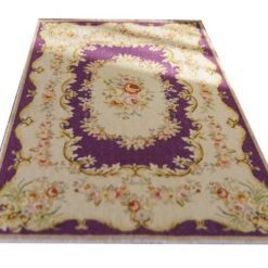 ubusson style miniature rug in purple with floral motifs and delicate detailing