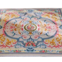 Victorian Floral Miniature Rug 8 Floral French Aubusson miniature rug with vibrant pink, yellow, and blue flowers and a cream background.