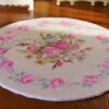 Miniature shabby chic Victorian rug with a soft floral pattern featuring pink roses.
