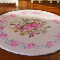 Miniature shabby chic Victorian rug with a soft floral pattern featuring pink roses.