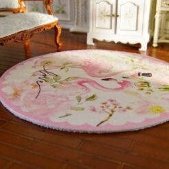 Miniature rug with two pink flamingos surrounded by floral elements and soft colors.