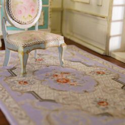 Victorian style miniature rug with purple background and floral accents
