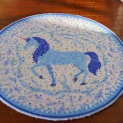 Miniature unicorn rug featuring a blue unicorn within a floral wreath.