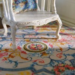 Victorian Floral Miniature Rug 9 Floral French Aubusson miniature rug with vibrant pink, yellow, and blue flowers and a cream background.