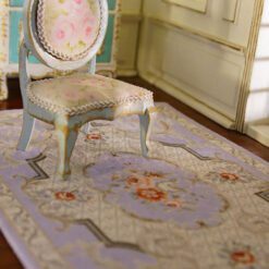 Victorian style miniature rug with purple background and floral accents