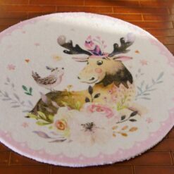 A miniature rug featuring a moose with floral designs and a bird on a white background.