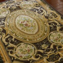 French Aubusson Floral Miniature Rug 13 French Aubusson miniature rug with floral medallions and gold scroll designs on a dark brown background.