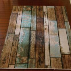 Miniature modern wooden floor rug with brown, blue, and green tones, featuring a distressed wood pattern.