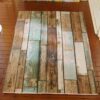 Miniature modern wooden floor rug with brown, blue, and green tones, featuring a distressed wood pattern.