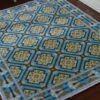 Diamond pattern miniature dollhouse rug with gold medallions and blue background